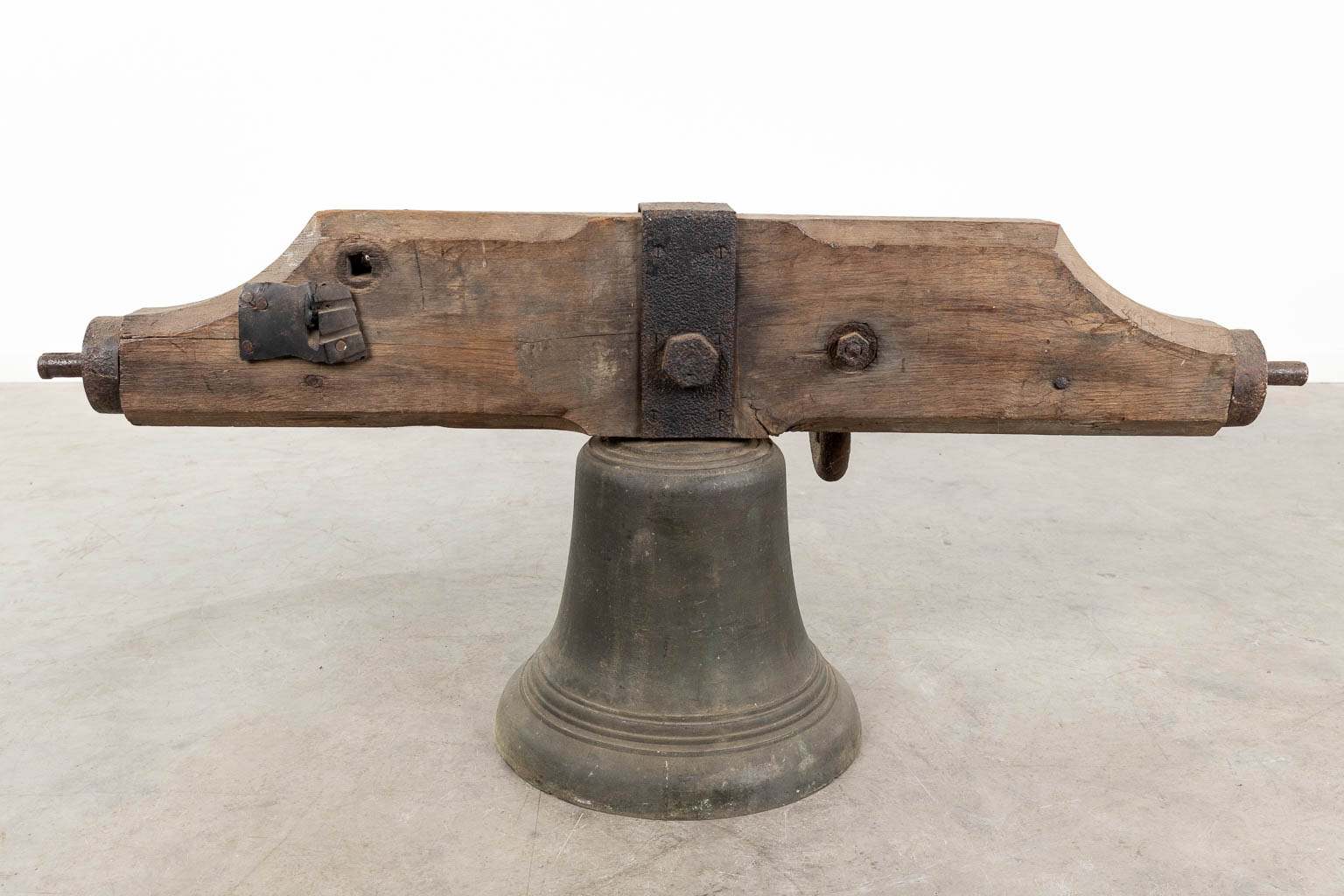 An antique bronze bell mounted on a wood base. 18th C. (W:120 x H:52 x D:36 cm) - Image 6 of 11