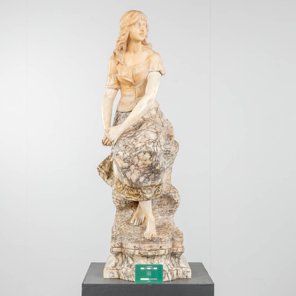 A statue of a lady, seated on a rock. Sculptured alabaster. 19th c. (D:27 x W:28 x H:88 cm) - Image 2 of 11