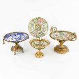 Three tazzas made of porcelain on a bronze base added a Kanton plate. 19th/20th C. (D:23 x W:29 x H: