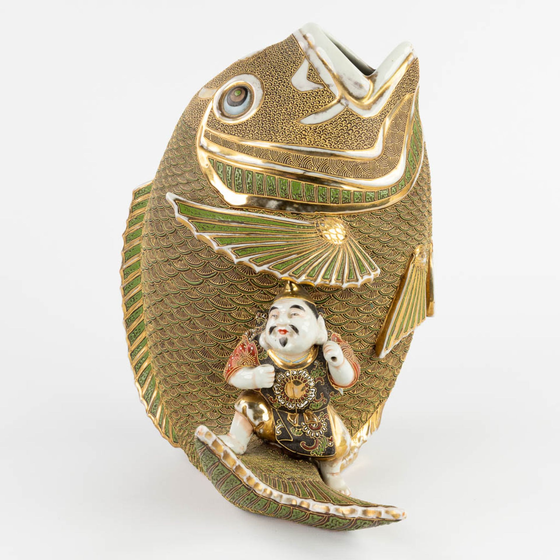 A figurine seaed on a koi, Satsuma stoneware. Meji period. (D:27 x W:26 x H:31 cm) - Image 3 of 11