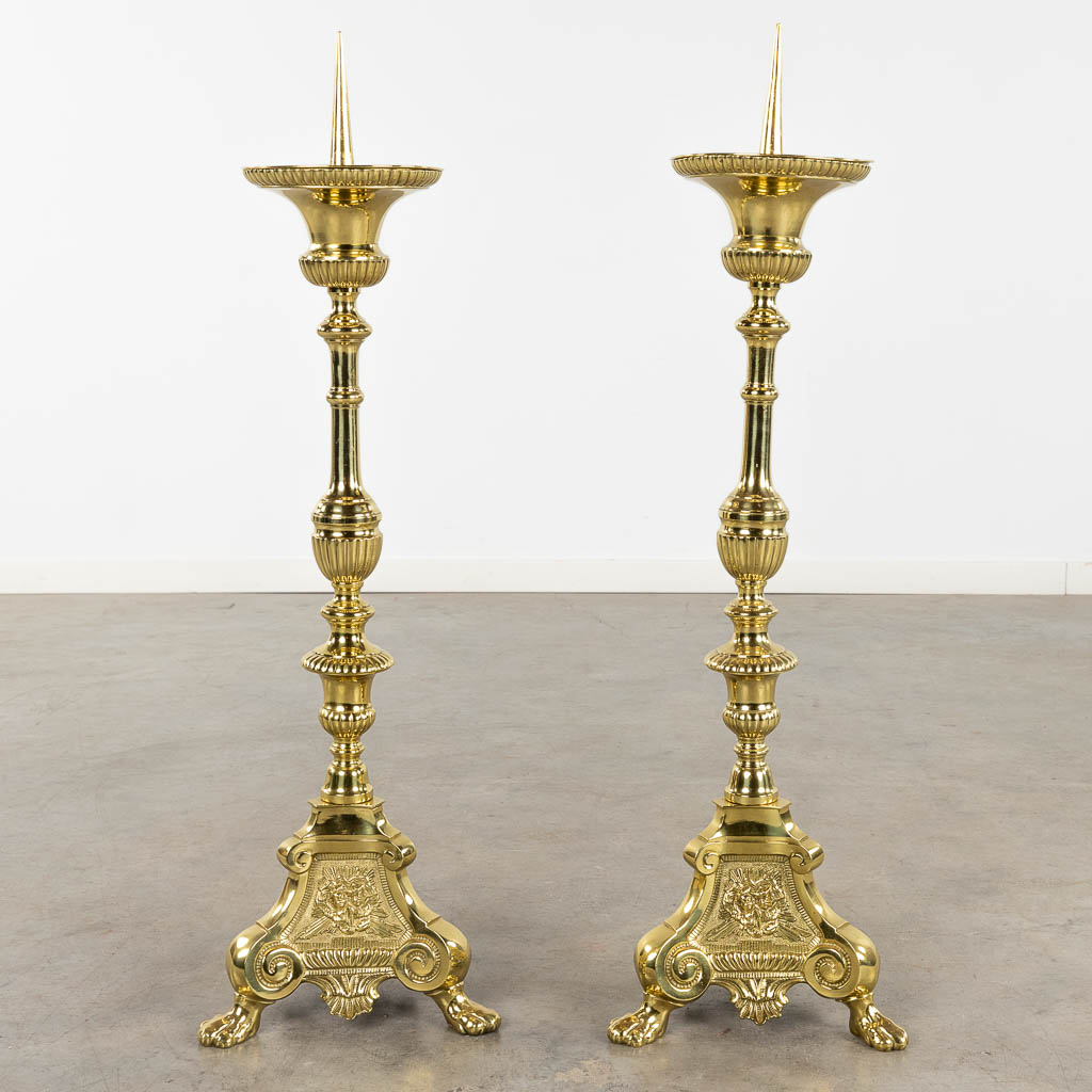 A pair of church candlesticks or candle holders polished bronze. 19th C. (D:24 x W:27 x H:88 cm)