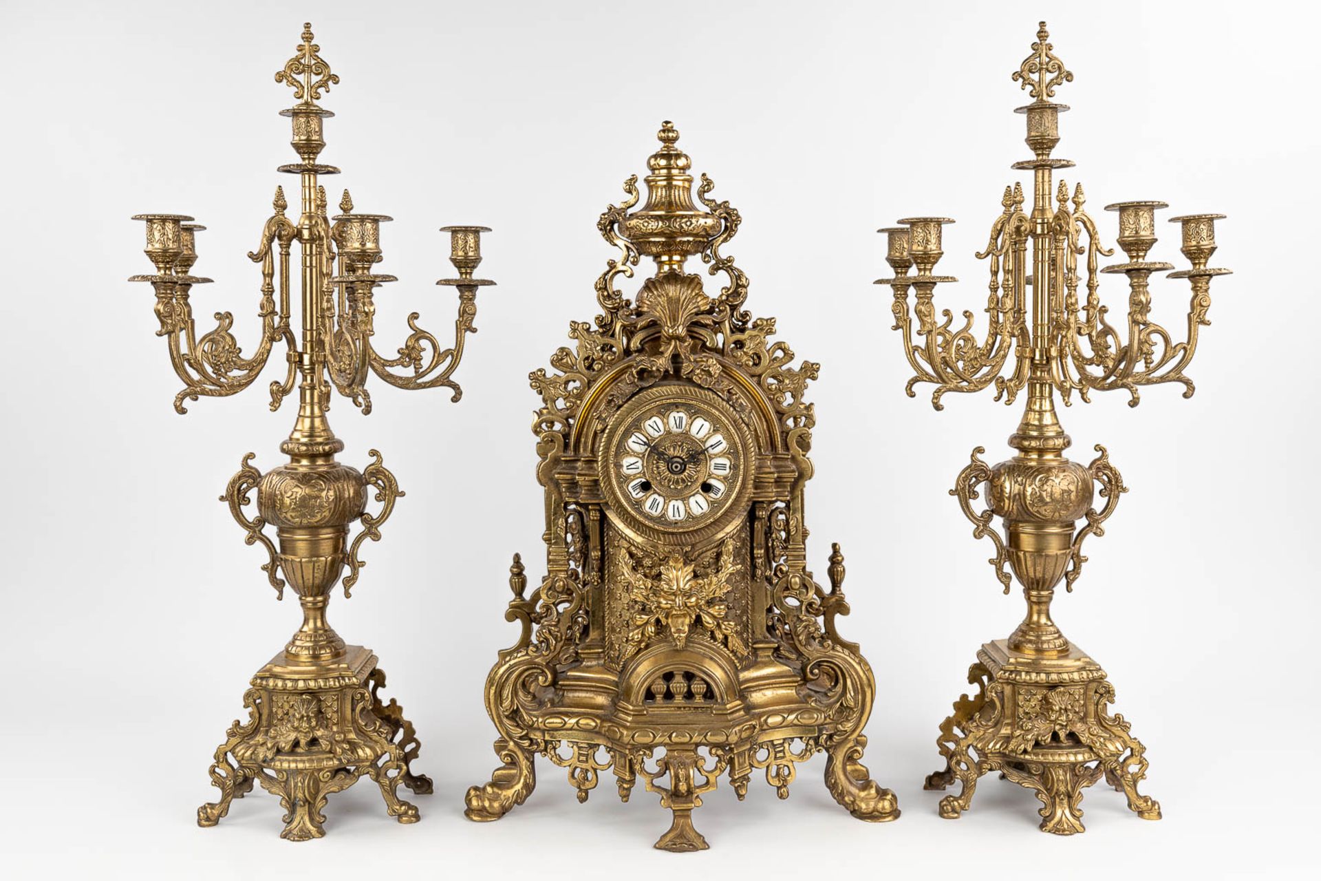 A three-piece mantle garniture consisting of a clock with candelabra, made of bronze. circa 1970. (W - Image 4 of 16