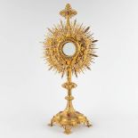 A large sunburst monstrance, brass, Gothic Revival, decorated with cabochons. Circa 1900. (D:24 x W: