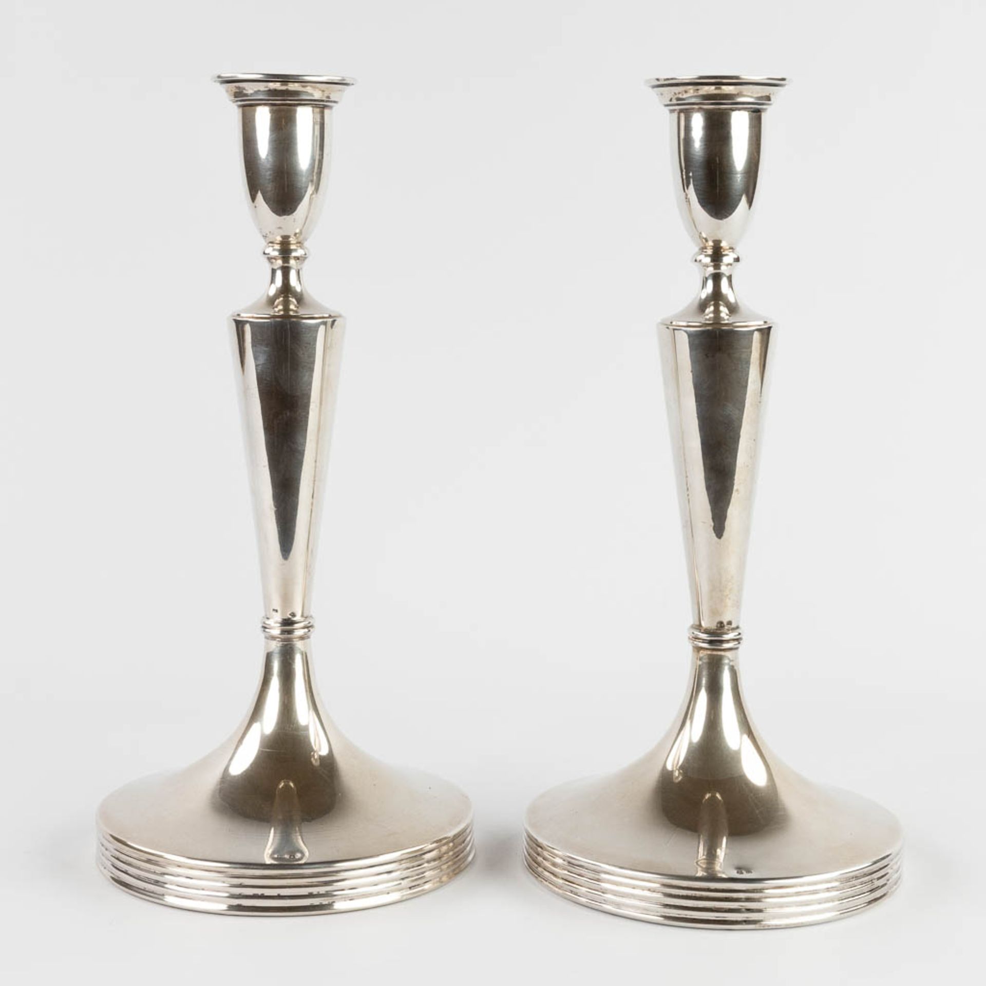 A pair of candle holders, silver, 800/1000, marked Vienna, Austria. 1872-1922. 1152g. (W:16,5 x H:34