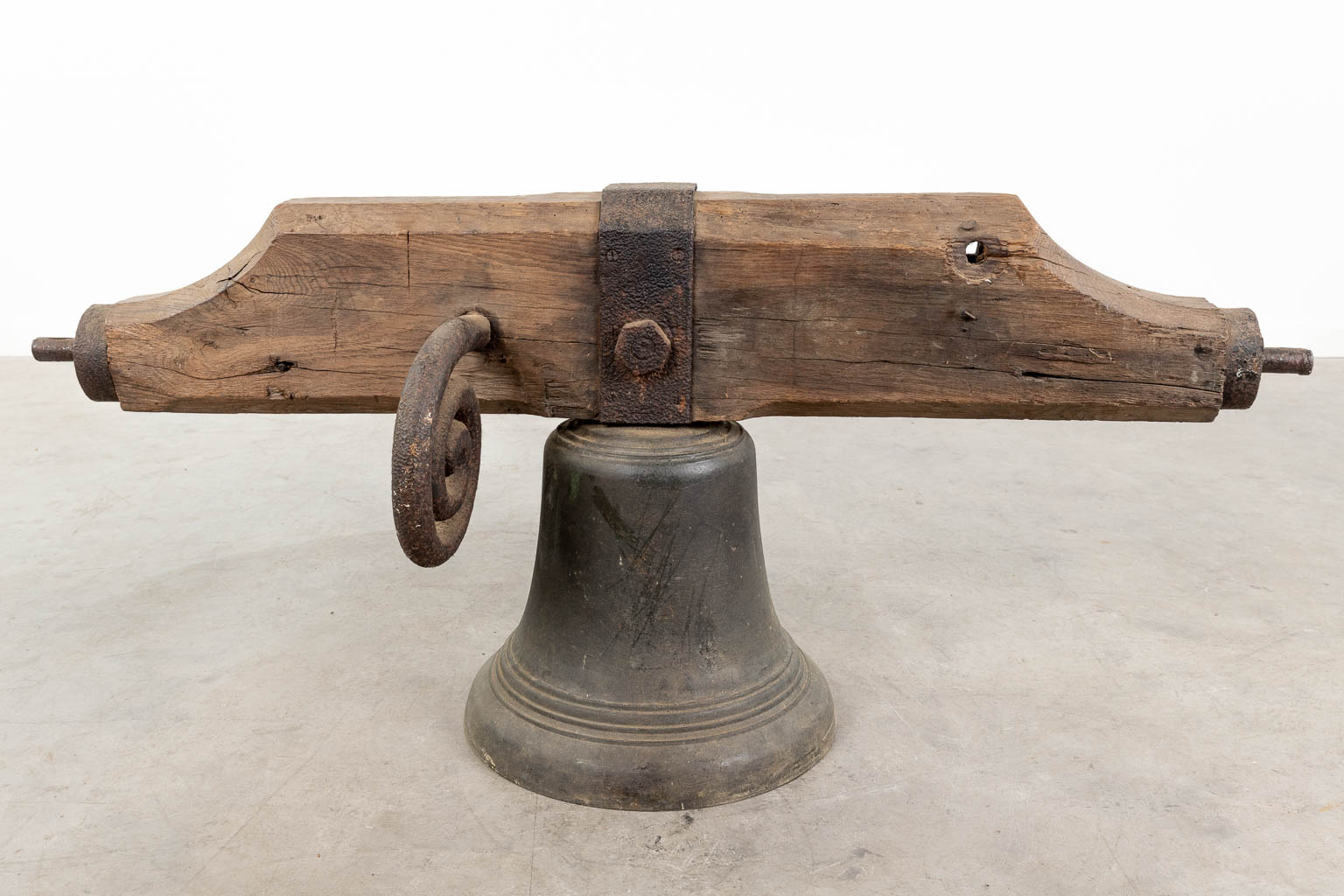 An antique bronze bell mounted on a wood base. 18th C. (W:120 x H:52 x D:36 cm) - Image 4 of 11