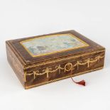 A decorative jewellery box with hand-painted decor. (D:28 x W:36,5 x H:11 cm)