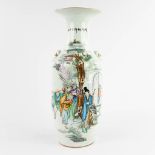 A Chinese vase, decorated with figurines in a garden. 19th/20th C. (H:57 x D:23 cm)