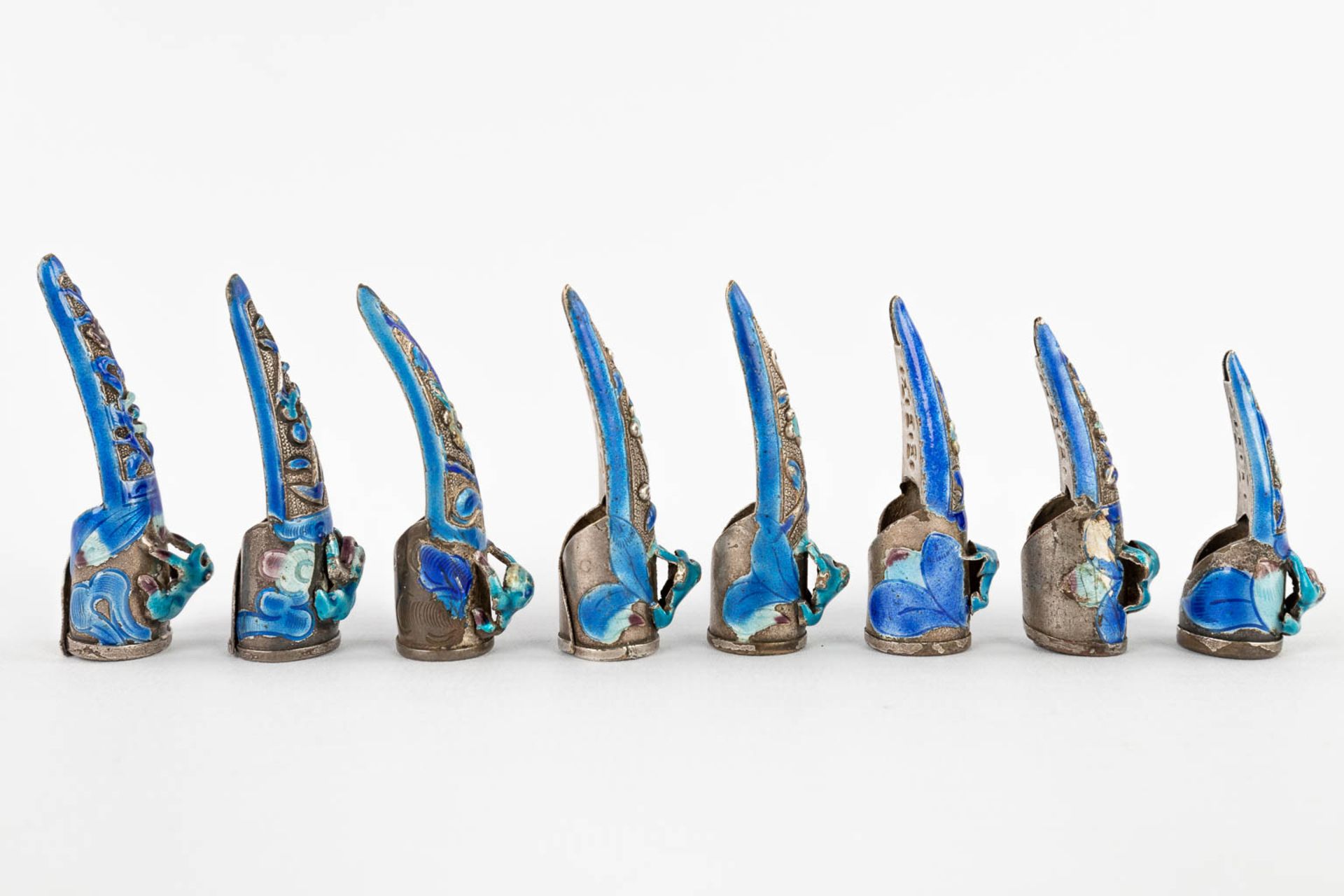 A collection of 8 Chinese nail guards, 19th C. (D:5,6 cm) - Image 4 of 12