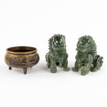 A Chinese bronze 'Tripod Cencer', added a pair of Foo dogs, sculptured stone. (D:7 x W:12 x H:12 cm)