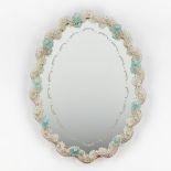 A small Venetian glass wall-mounted mirror, decorated with blue flowers. (W:45 x H:60 cm)