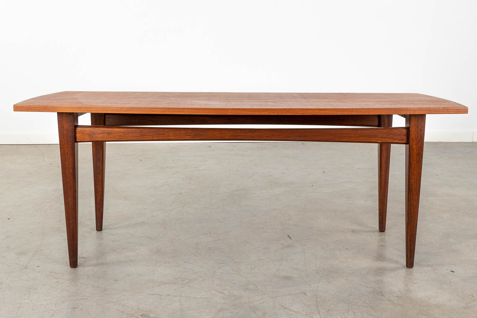 A mid-century Scandinavian coffee table, probably solid teak. (D:50 x W:120 x H:45 cm) - Image 3 of 10