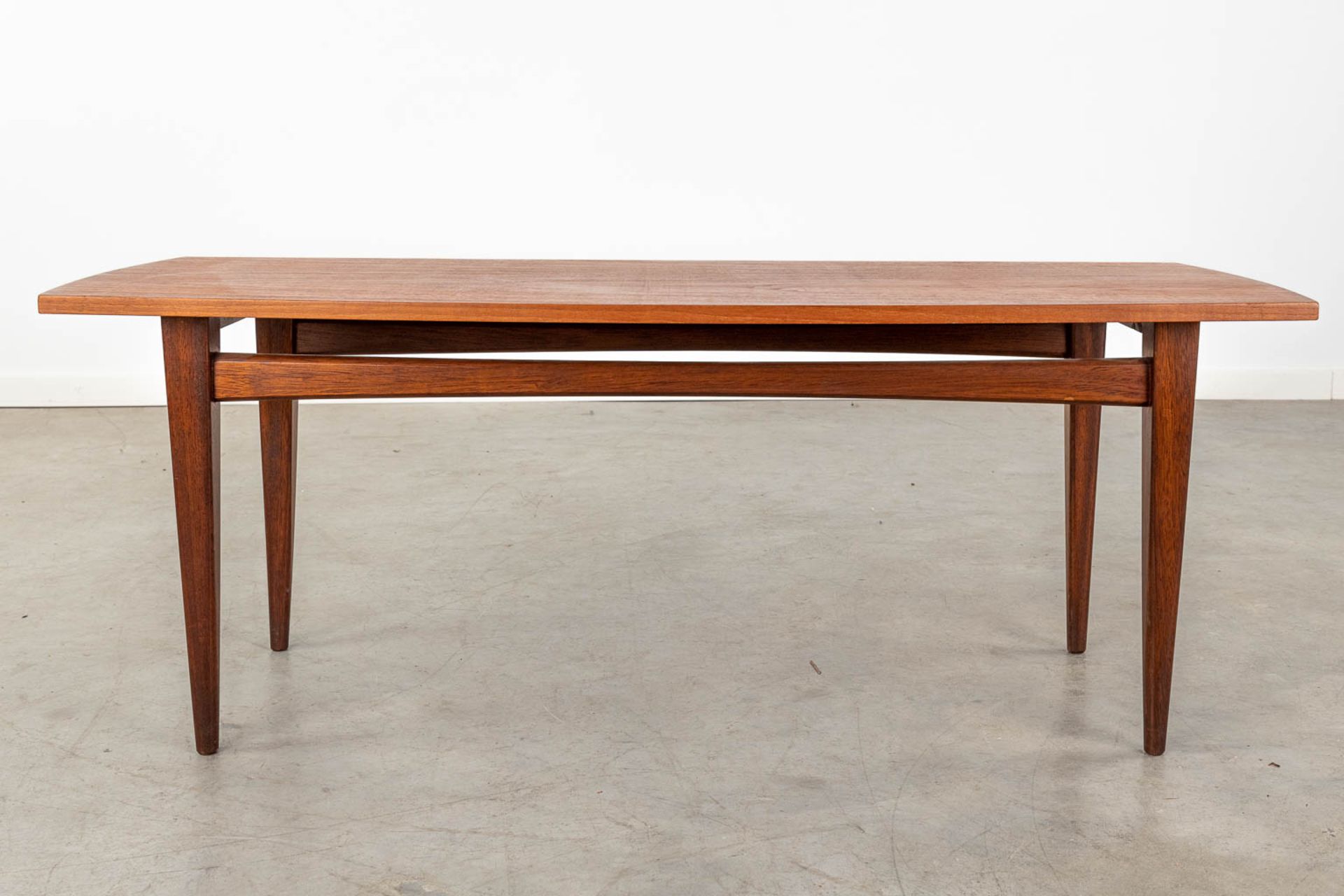 A mid-century Scandinavian coffee table, probably solid teak. (D:50 x W:120 x H:45 cm) - Image 3 of 10