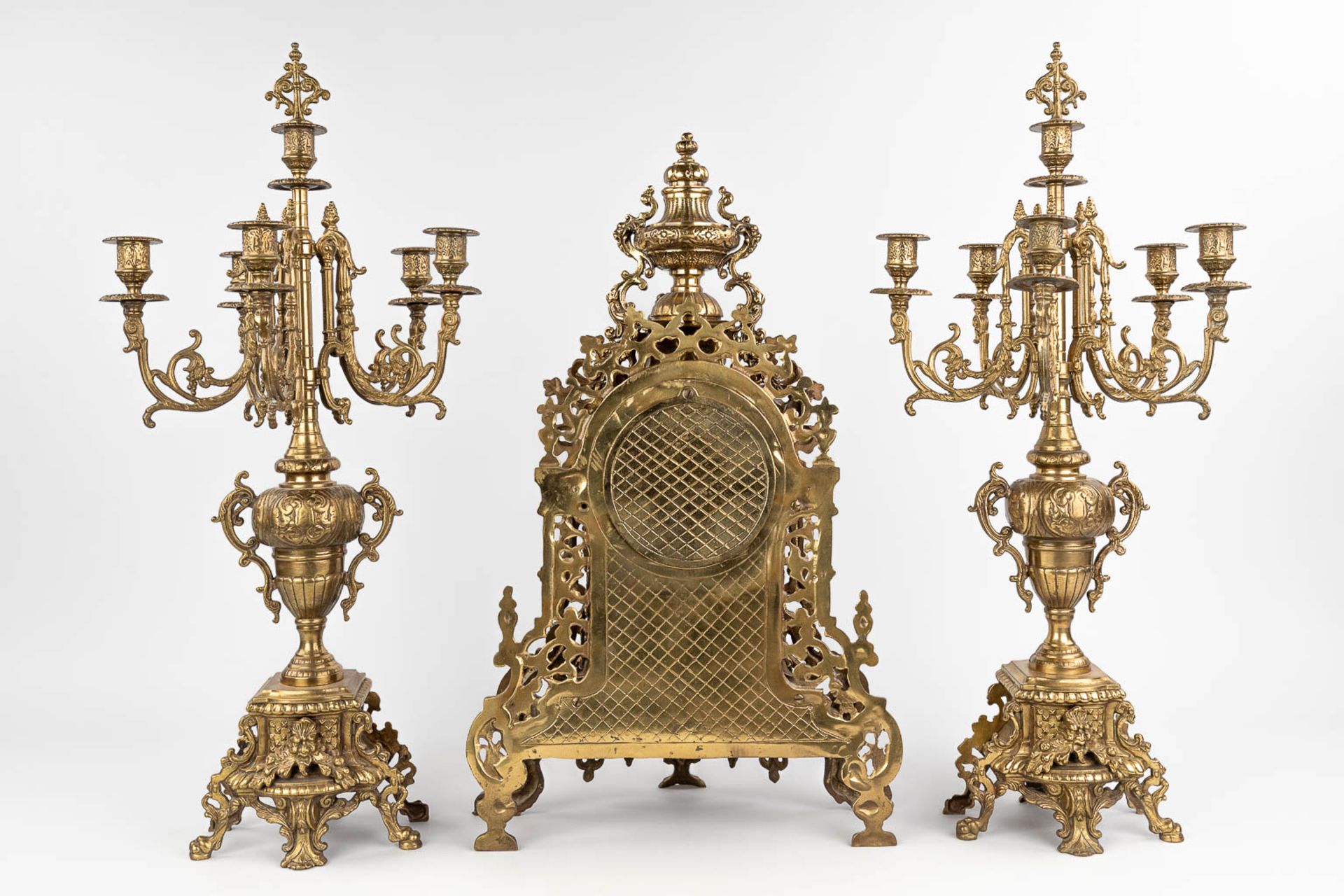A three-piece mantle garniture consisting of a clock with candelabra, made of bronze. circa 1970. (W - Image 6 of 16