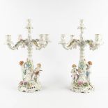 A pair of candelabra, polychrome porcelain decorated with figurines. Marked PMP, 20th C. (D:37 x W:3