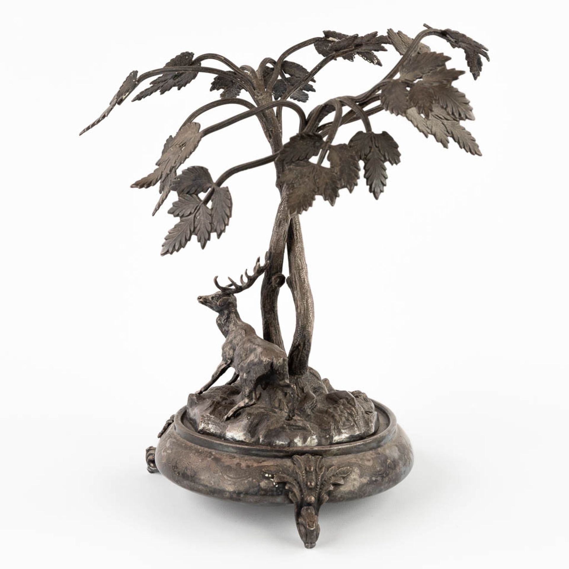 A figurine of a deer, walking under tall trees. Silver-plated bronze. Circa 1900. (D:24 x W:30 x H:3 - Image 7 of 13