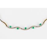 A necklace, 18 karats yellow and white gold, decorated with green, probably, emeralds. 24,67g.