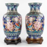 A pair of large cloisonné vases decorated with fauna and flora. 20th C. (H:51 x D:28 cm)