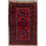 An Oriental hand-made carpet, Kazak. 1949. (D:230 x W:150 cm)