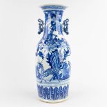 A Chinese vase, blue and white decor of a deer with other fauna and flora. 19th/20th C. (H:61 x D:23