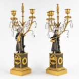 A pair of candelabra, gilt and patinated bronze, Empire, 19th C. (D:15 x W:24 x H:53 cm)