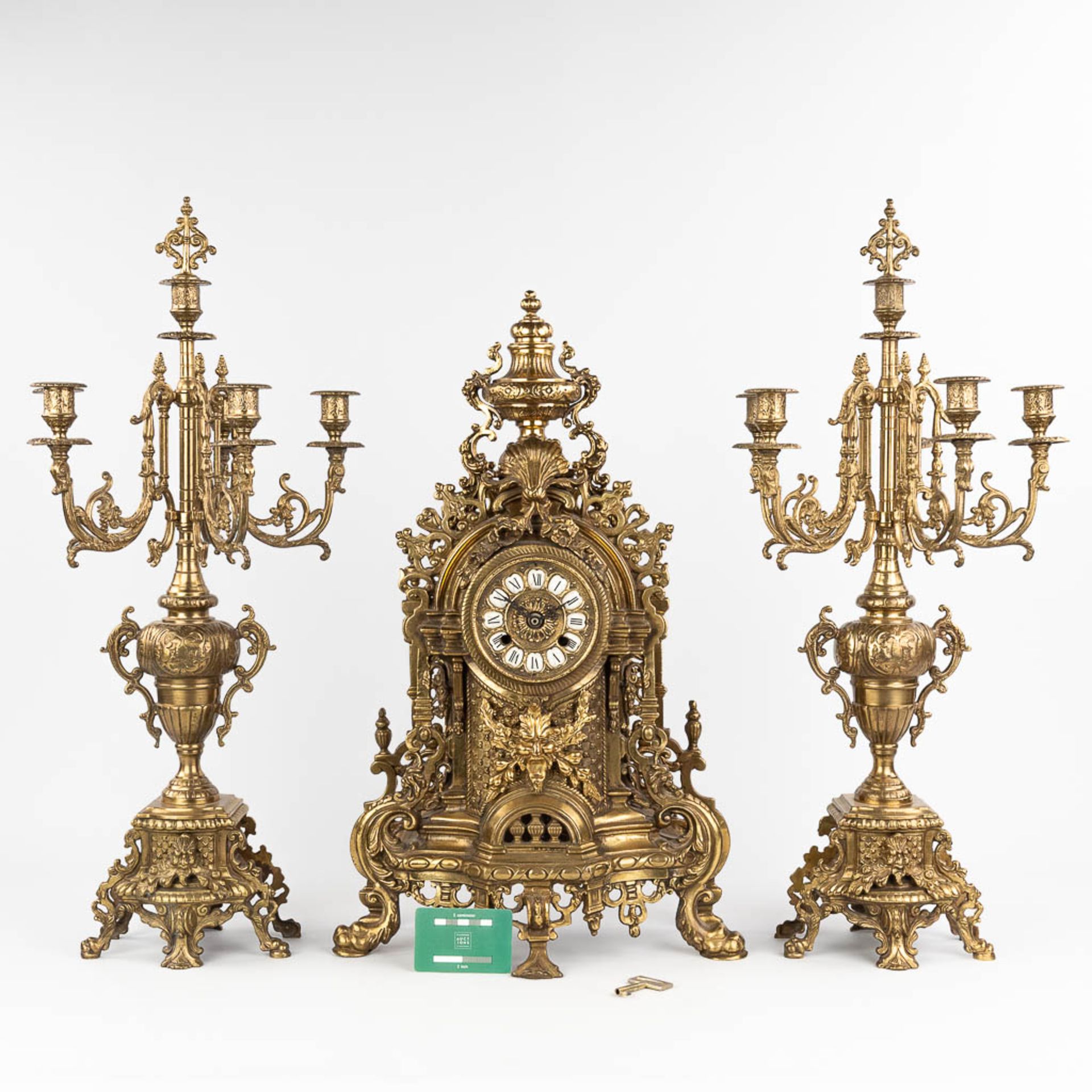 A three-piece mantle garniture consisting of a clock with candelabra, made of bronze. circa 1970. (W - Image 2 of 16