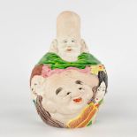 A Japanese 'Banko Ware' jar with lid, '7 Lucky Gods' porcelain with a polychrome decor. Circa 1900.
