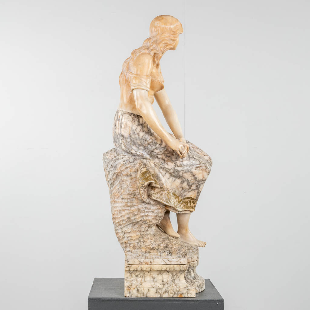 A statue of a lady, seated on a rock. Sculptured alabaster. 19th c. (D:27 x W:28 x H:88 cm) - Image 5 of 11