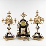A three-piece mantle garniture clock with candelabra, porcelain mounted with bronze, marked A.C.F. d