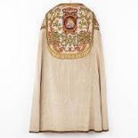 A lithurgical vestment 'Cope', thick handmade gold and coloured thread embroideries with an image of