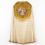 A lithurgical vestment 'Cope', thick gold thread embroideries with an image of the holy family.