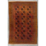 An Oriental hand-made carpet, Afghan. (D:345 x W:230 cm)