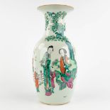 A Chinese vase decorated with ladies and children, 19th/20th C. (H:44 x D:21 cm)