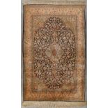 An Oriental hand-made carpet, silk and wool, Tabriz. (D:104 x W:160 cm)