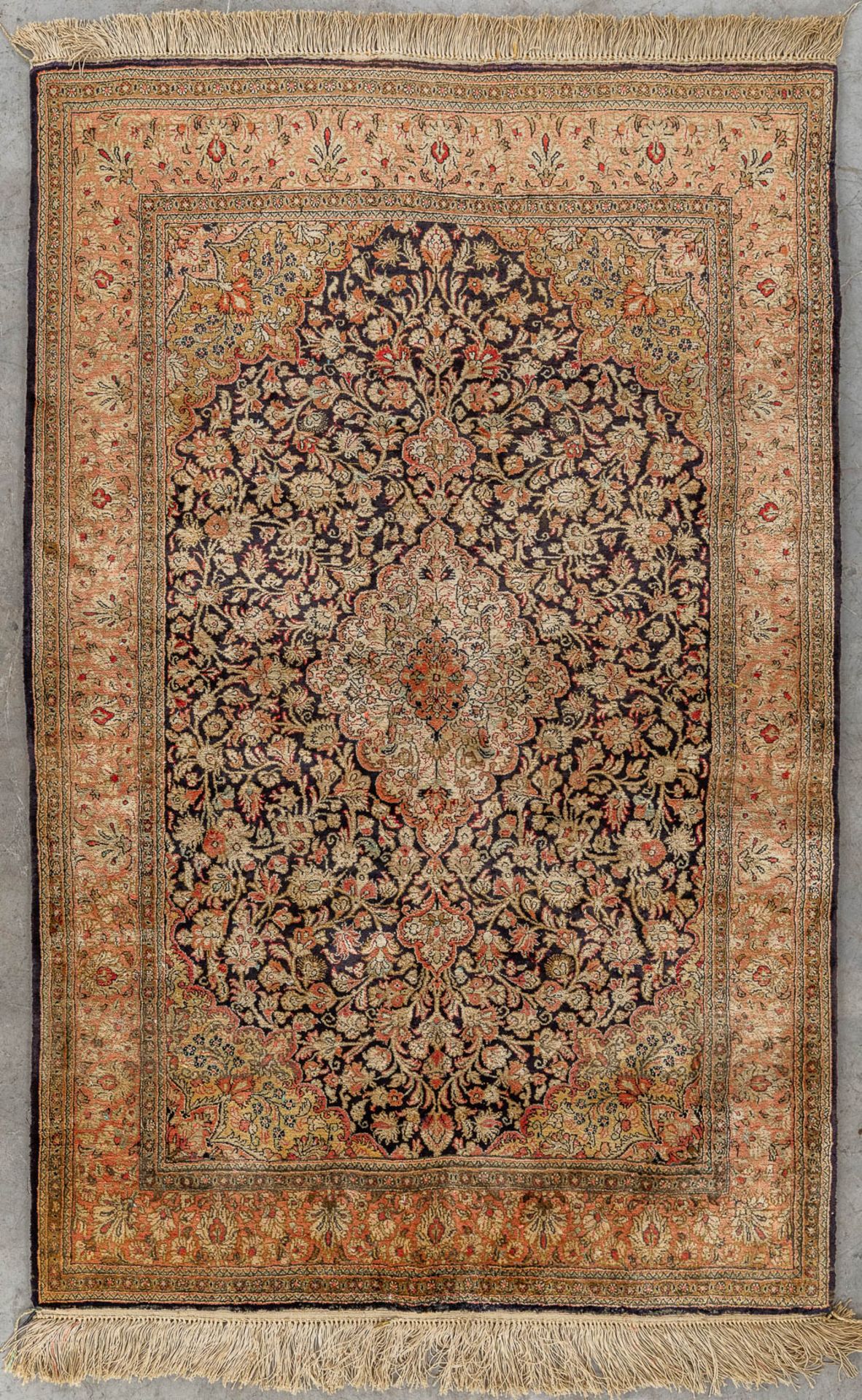 An Oriental hand-made carpet, silk and wool, Tabriz. (D:104 x W:160 cm)