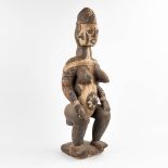 A decorative wood sculptured 'Maternity Statue' Idoma, Nigeria. (D:24 x W:24 x H:84 cm)