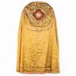 A lithurgical vestment 'Cope', thick gold thread embroideries with an image of the pelican with youn