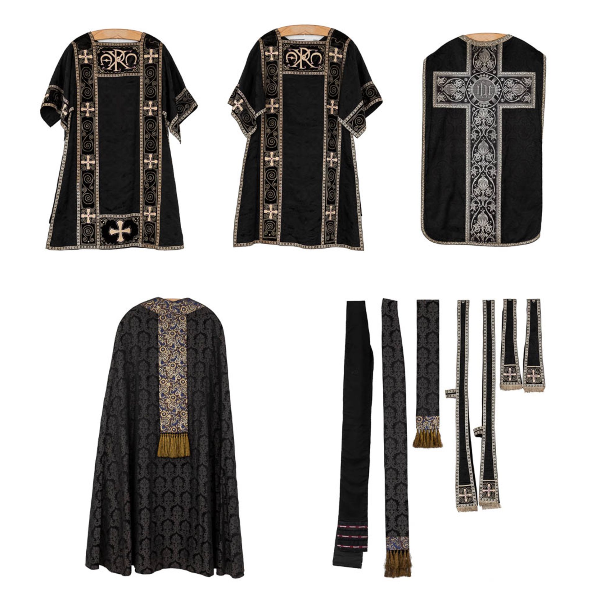 A Roman Chasuble, Two Dalmatics and a Cope. Black textile with embroideries.