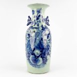 A Chinese vase, blue-white decorated with a bird. 19th/20th C. (H:58 x D:23 cm)