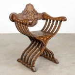An antique chair, sculptured wood with inlayed bone, probably Syria, Circa 1900. (D:52 x W:73 x H:92