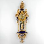 An exceptional clock, porcelain mounted with brass and hand-painted polychrome decors, 20th C. (W:54