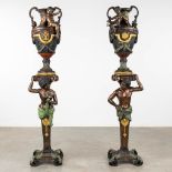 A pair of large urns standing on pedstals, decorated with figurines, bronze, 20th C. (D:38 x W:40 x