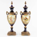 Sèvres, A pair of kobalt blue, bronze mounted and hand painted vases. 20th C. (D:16 x W:19 x H:54 cm
