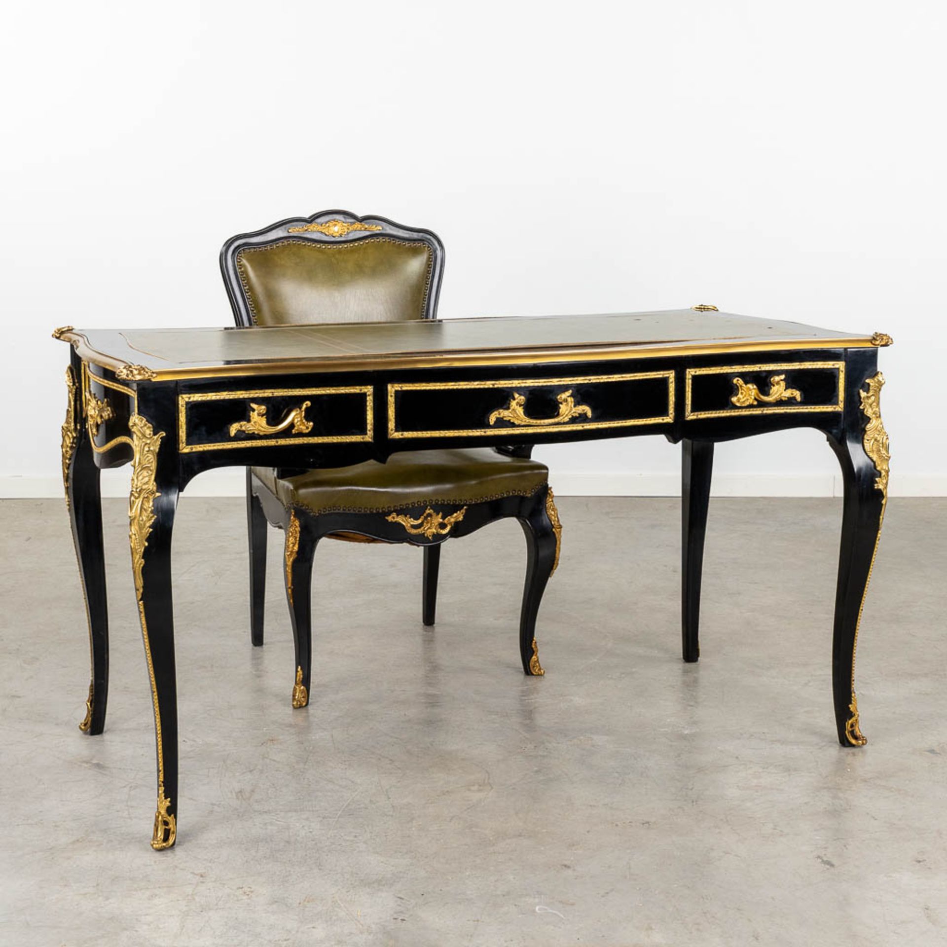 A desk with matching armchair, lacquered and bronze mounted in Louis XV style. 20th C. (D:68 x W:138