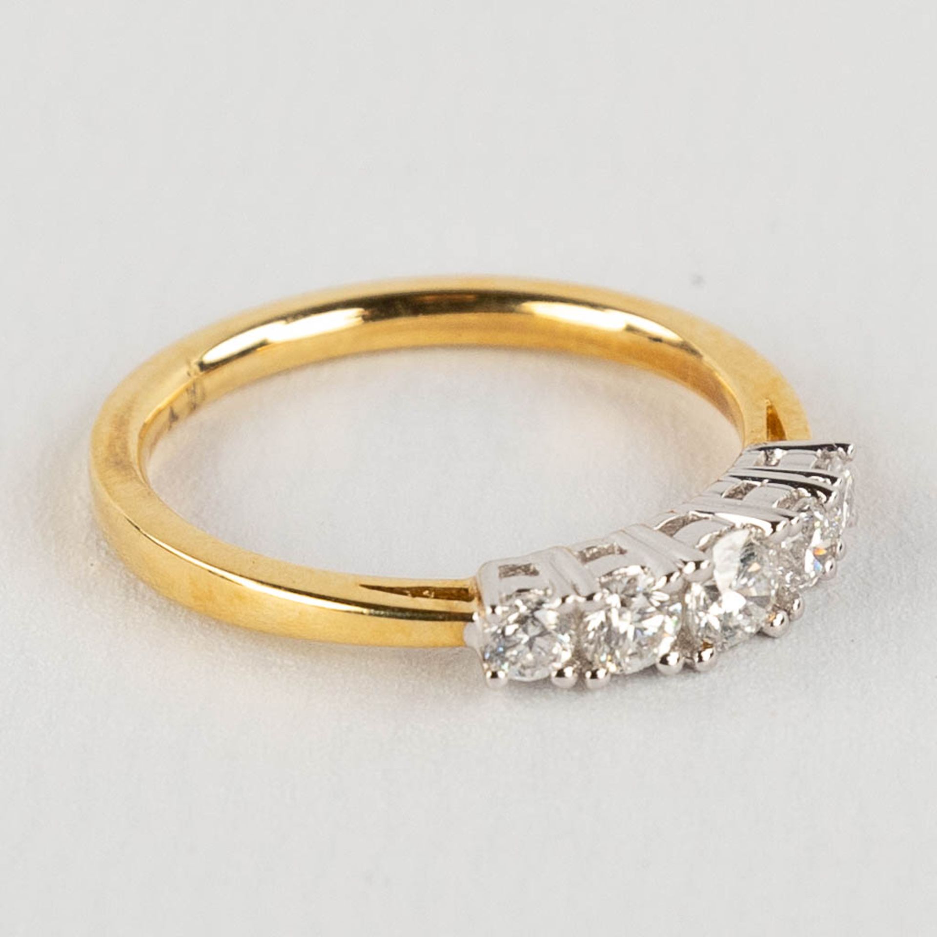 A ring, 18kt yellow and white gold with 5 diamonds, appr. 0,52ct. Ring size 54. - Image 3 of 11