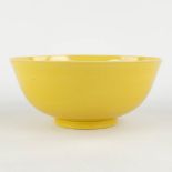 A Chinese bowl with monochrome yellow glaze, Tonghzi mark and period. 19th C. (H:9 x D:20,5 cm)