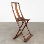 An antique Chinese travellers folding chair, probably 18th/19th C. (D:50 x W:60 x H:116 cm)