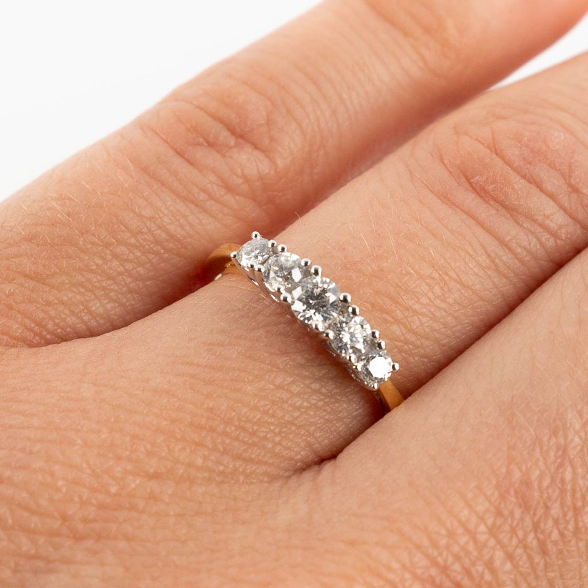 A ring, 18kt yellow and white gold with 5 diamonds, appr. 0,52ct. Ring size 54. - Image 9 of 11