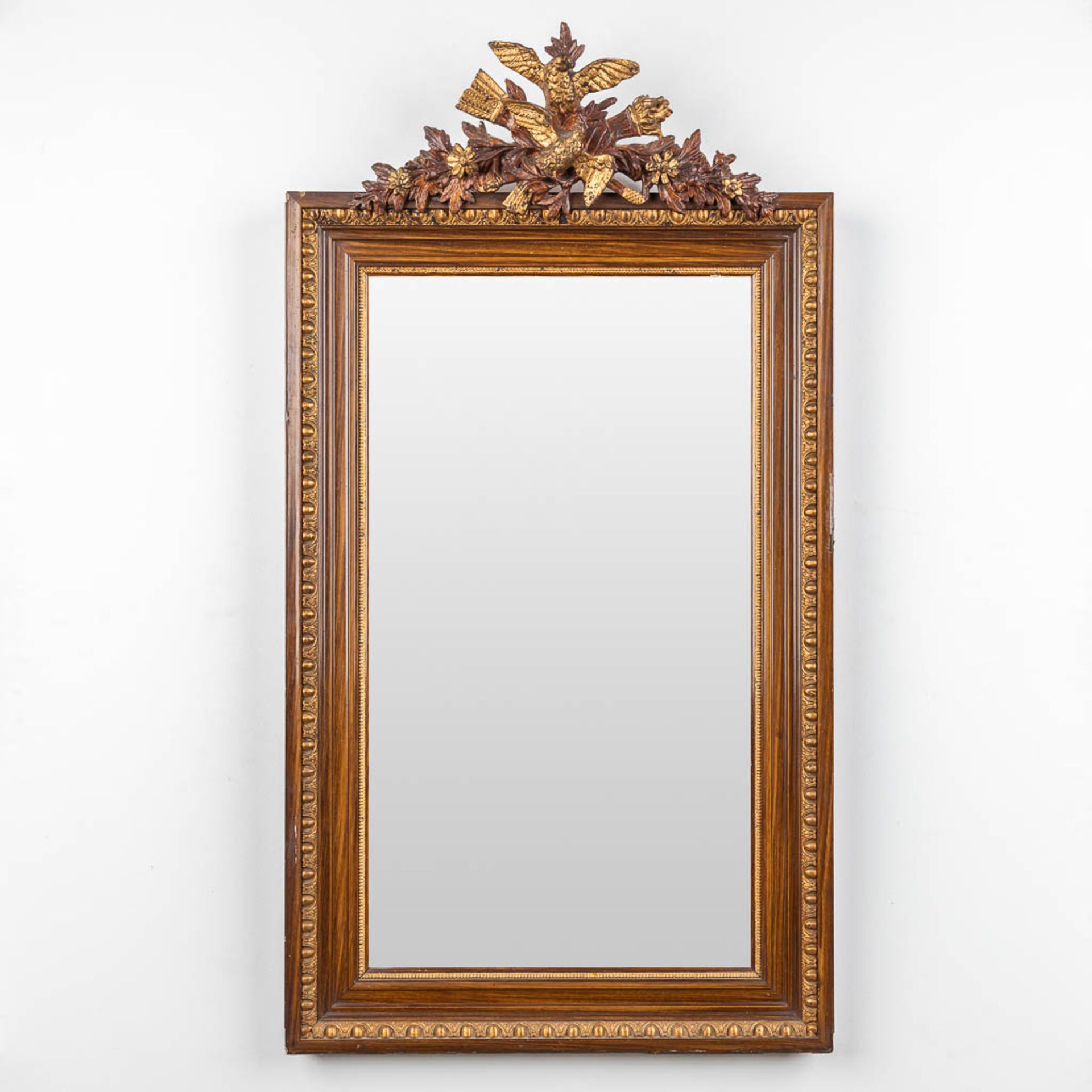 An elegant mirror decorated with lovebirds, circa 1920. (W:58 x H:107 cm)