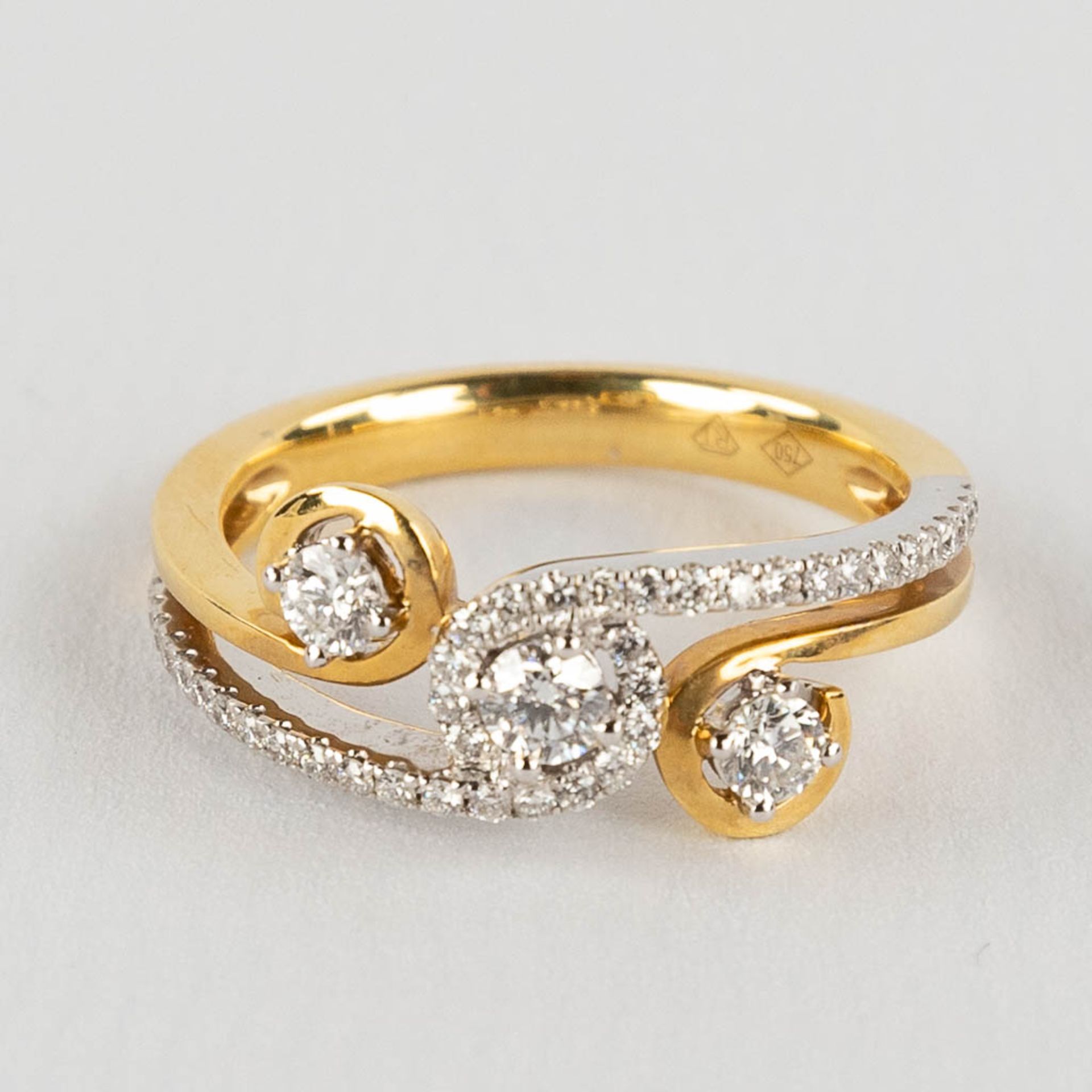 A ring, 18kt yellow and white gold with diamonds, appr. 0,48ct. Ring size 54.
