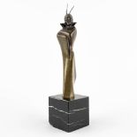 A figurine 'Mephisto', patinated bronze mounted on marble, Art Deco. (D:6 x W:6 x H:25 cm)